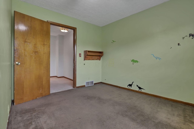 6605 Lancaster Rd SE, Hebron, OH 43025 - carpeted empty room featuring a textured ceiling and baseboards