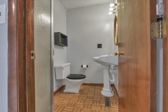 6605 Lancaster Rd SE, Hebron, OH 43025 - half bathroom with toilet and a textured ceiling