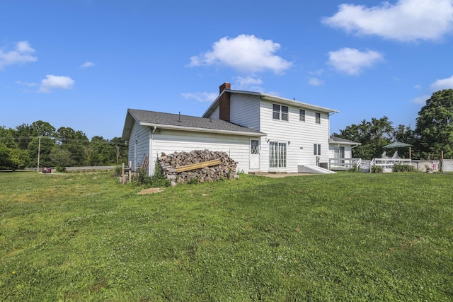 6605 Lancaster Rd SE, Hebron, OH 43025 - back of house with a chimney and a yard