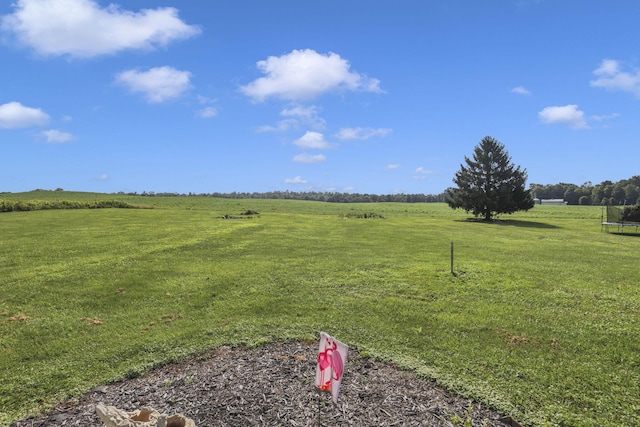 6605 Lancaster Rd SE, Hebron, OH 43025 - view of green lawn featuring a view of countryside and a trampoline