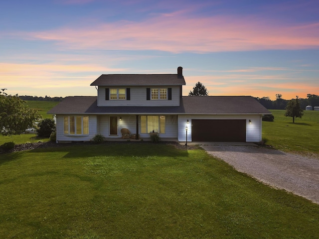 6605 Lancaster Rd SE, Hebron, OH 43025 - traditional home featuring driveway, a garage, a front yard, and a porch