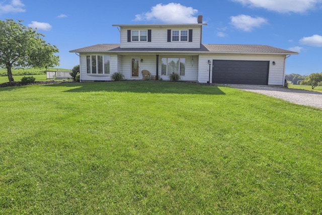 6605 Lancaster Rd SE, Hebron, OH 43025 - view of front of home featuring driveway, a front lawn, a garage, and a chimney