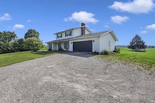 6605 Lancaster Rd SE, Hebron, OH 43025 - view of front of house with driveway, a chimney, a garage, and a front yard