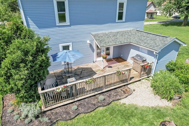 2635 Main St, Powell, OH 43065 - rear view of property with a deck, a yard, and roof with shingles