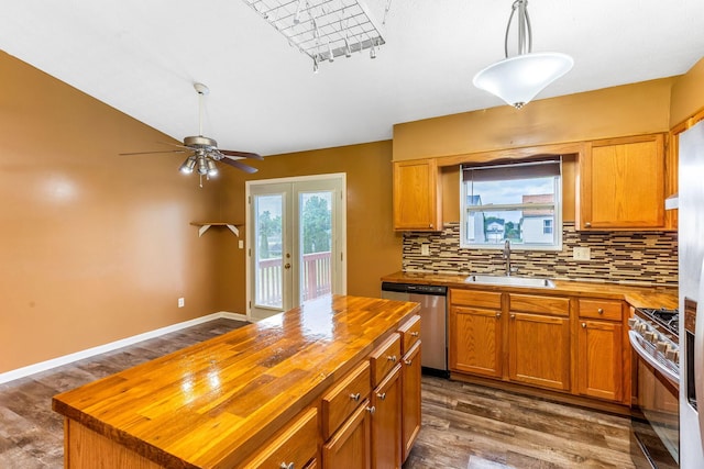 5733 Canal Bridge Dr, Canal Winchester, OH 43110 - kitchen with wooden counters, appliances with stainless steel finishes, tasteful backsplash, french doors, and dark wood-type flooring