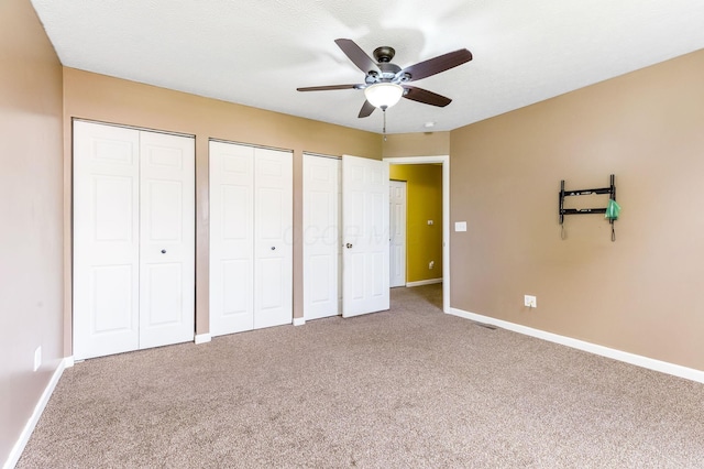 5733 Canal Bridge Dr, Canal Winchester, OH 43110 - unfurnished bedroom featuring multiple closets, carpet floors, and ceiling fan
