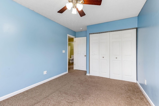 5733 Canal Bridge Dr, Canal Winchester, OH 43110 - unfurnished bedroom featuring carpet, a textured ceiling, a closet, and a ceiling fan