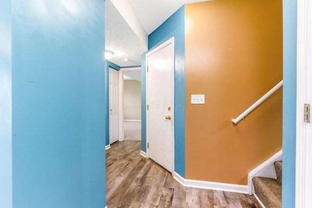 5733 Canal Bridge Dr, Canal Winchester, OH 43110 - corridor with wood finished floors, a textured ceiling, and stairs