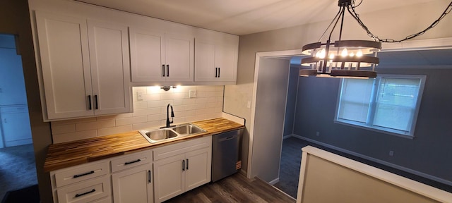 1710 Hess Blvd, Columbus, OH 43212 - kitchen featuring stainless steel dishwasher, butcher block countertops, a chandelier, tasteful backsplash, and white cabinets