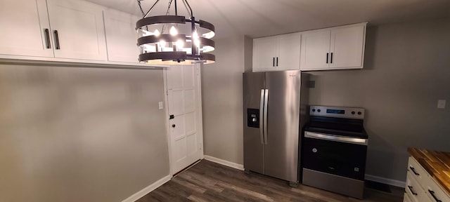 1710 Hess Blvd, Columbus, OH 43212 - kitchen with appliances with stainless steel finishes, a chandelier, dark wood-style flooring, white cabinets, and hanging light fixtures