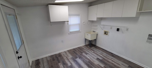 1710 Hess Blvd, Columbus, OH 43212 - laundry area with cabinet space, dark wood finished floors, and hookup for a washing machine