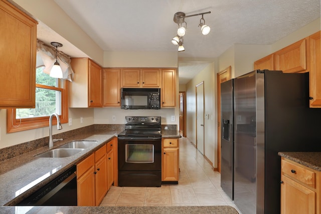 2885 Wynneleaf St, Hilliard, OH 43026 - kitchen featuring black appliances, light tile patterned floors, and dark stone counters