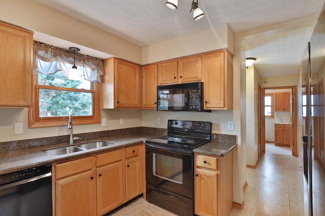 2885 Wynneleaf St, Hilliard, OH 43026 - kitchen with black appliances, healthy amount of natural light, light tile patterned flooring, and a textured ceiling