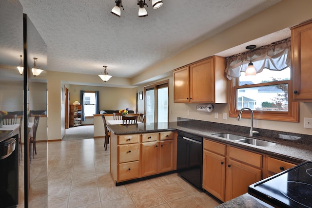 2885 Wynneleaf St, Hilliard, OH 43026 - kitchen with black dishwasher, a peninsula, light tile patterned floors, a textured ceiling, and pendant lighting