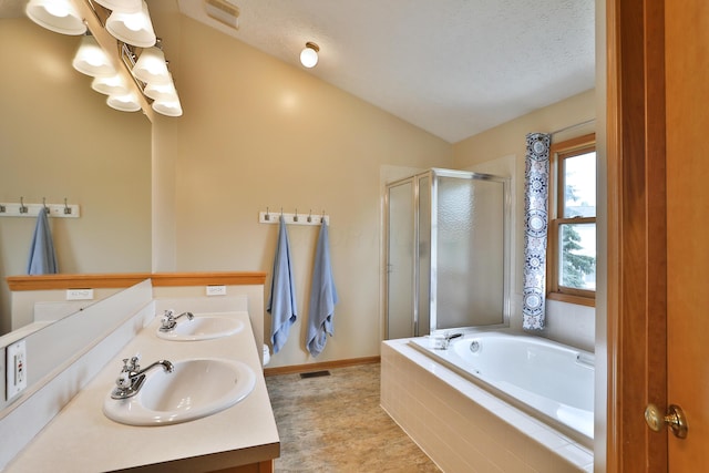 2885 Wynneleaf St, Hilliard, OH 43026 - bathroom featuring a shower stall, a chandelier, a garden tub, double vanity, and vaulted ceiling