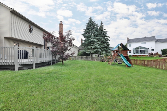 2885 Wynneleaf St, Hilliard, OH 43026 - fenced backyard with a playground and a wooden deck