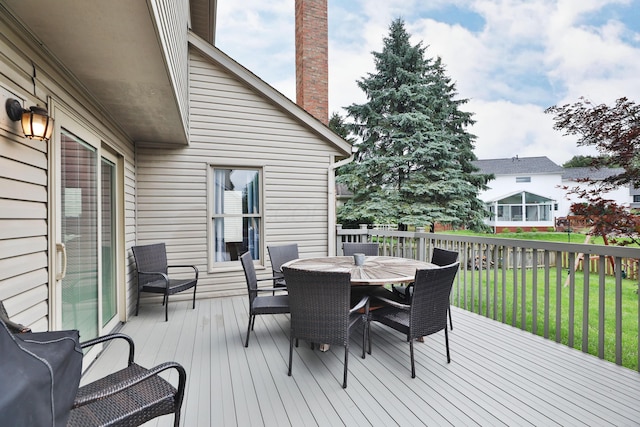 2885 Wynneleaf St, Hilliard, OH 43026 - wooden deck featuring outdoor dining area and a lawn