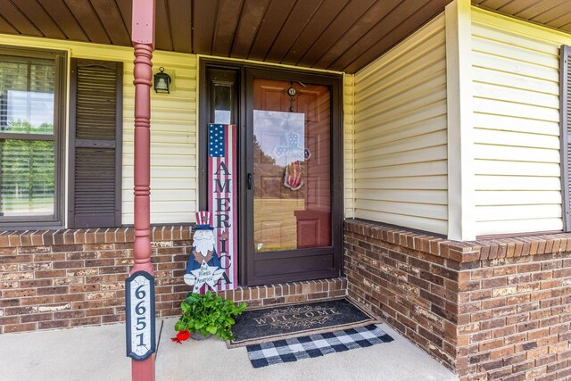 6651 Lancaster Rd, Hebron, OH 43025 - property entrance with a porch and brick siding