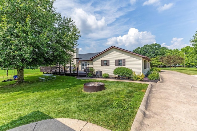 6651 Lancaster Rd, Hebron, OH 43025 - view of front facade featuring a fire pit, a wooden deck, and a front yard