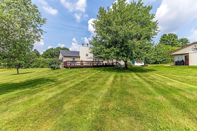 6651 Lancaster Rd, Hebron, OH 43025 - view of green lawn with a wooden deck
