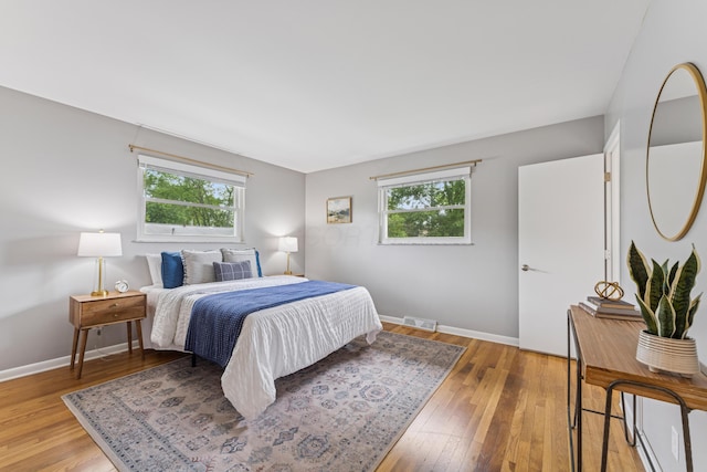 1838 Merriweather Dr, Columbus, OH 43221 - bedroom with multiple windows and light wood-type flooring