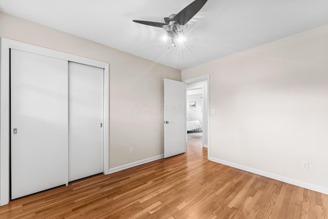1838 Merriweather Dr, Columbus, OH 43221 - unfurnished bedroom with light wood-style flooring, a closet, and a ceiling fan