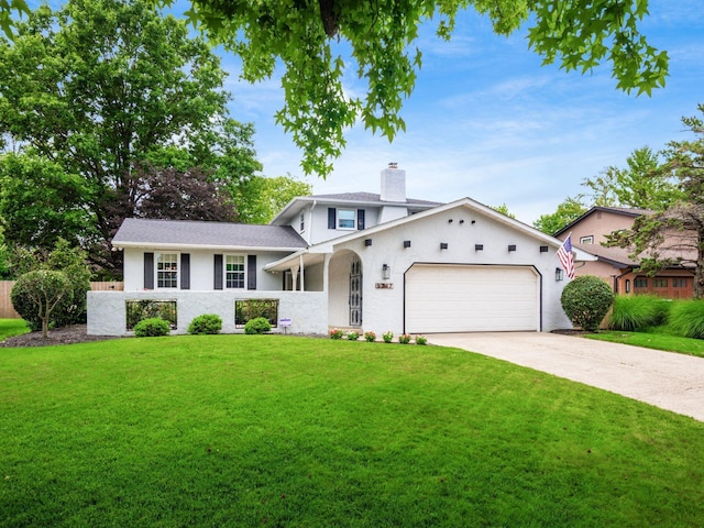 5247 Heathmoor St, Columbus, OH 43235 - split level home with a garage, driveway, and a front lawn