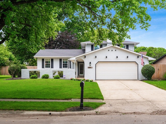 5247 Heathmoor St, Columbus, OH 43235 - view of front of property featuring a garage, concrete driveway, stucco siding, and a shingled roof