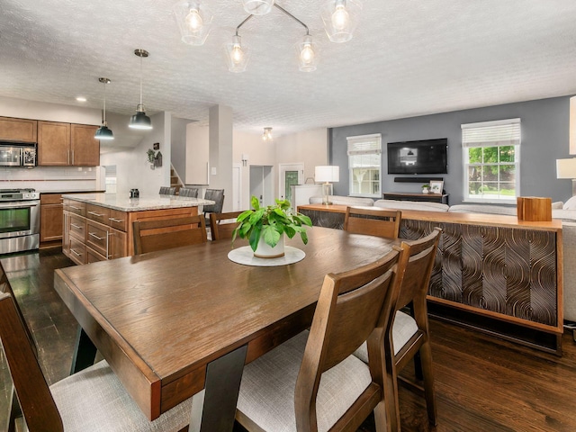 5247 Heathmoor St, Columbus, OH 43235 - dining space with dark wood-style flooring, stairway, and a textured ceiling