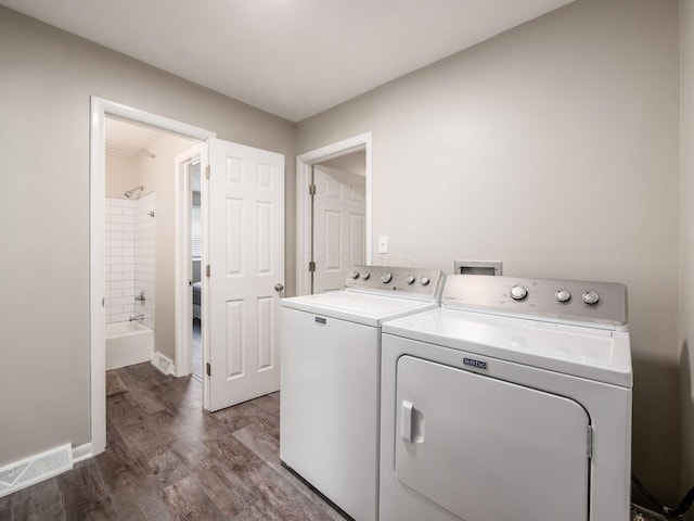 5247 Heathmoor St, Columbus, OH 43235 - laundry area featuring washing machine and clothes dryer and wood finished floors
