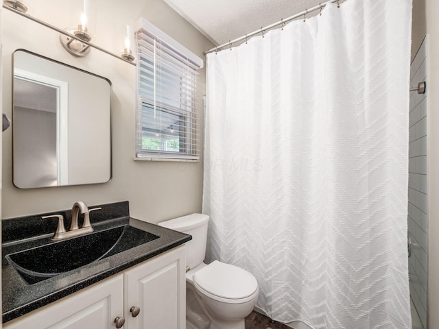 5247 Heathmoor St, Columbus, OH 43235 - bathroom featuring vanity, a textured ceiling, and a shower with curtain