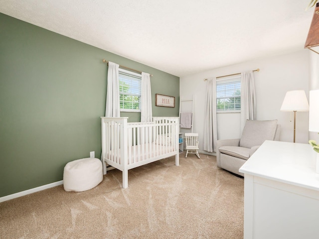 5247 Heathmoor St, Columbus, OH 43235 - bedroom featuring multiple windows, carpet floors, and a crib