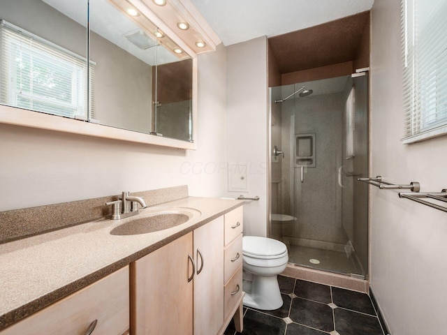 5247 Heathmoor St, Columbus, OH 43235 - full bath featuring a stall shower, tile patterned flooring, vanity, healthy amount of natural light, and recessed lighting