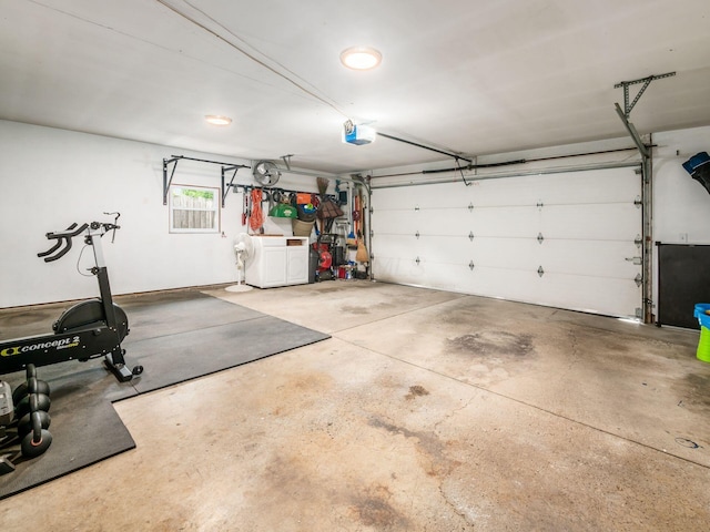 5247 Heathmoor St, Columbus, OH 43235 - garage featuring washing machine and clothes dryer and a garage door opener