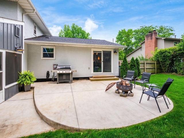 5247 Heathmoor St, Columbus, OH 43235 - rear view of house with stucco siding, an outdoor fire pit, and a patio
