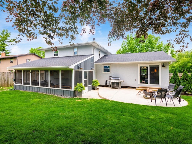 5247 Heathmoor St, Columbus, OH 43235 - rear view of house featuring a sunroom, a patio, an outdoor fire pit, and a shingled roof