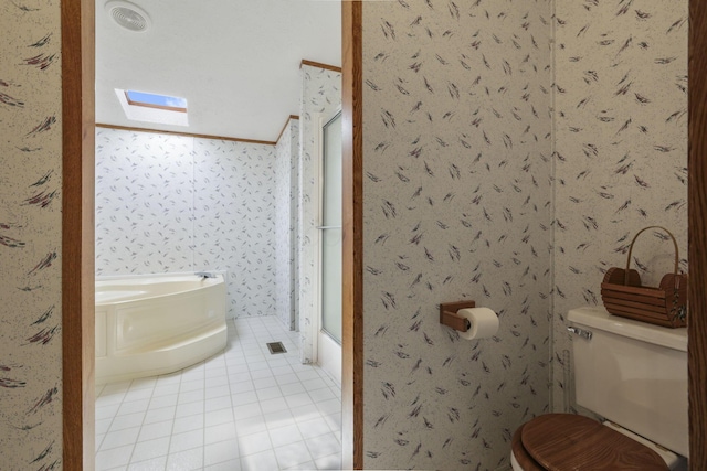 11791 Coontz Rd, Orient, OH 43146 - bathroom featuring tile patterned flooring, a bath, a shower stall, a skylight, and wallpapered walls