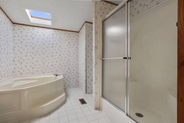 11791 Coontz Rd, Orient, OH 43146 - full bathroom with wallpapered walls, a garden tub, a skylight, an enclosed shower, and tile patterned floors