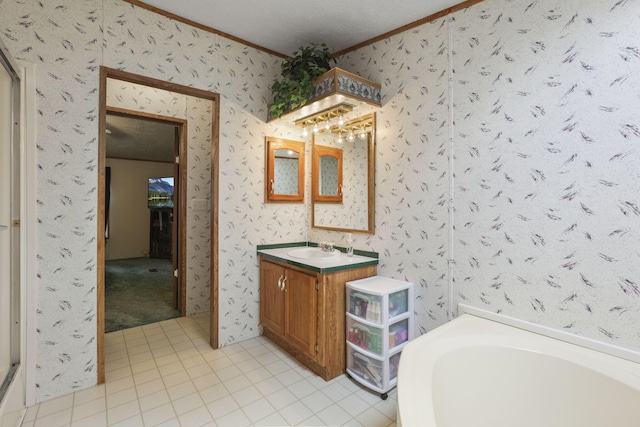 11791 Coontz Rd, Orient, OH 43146 - full bath with crown molding, tile patterned floors, vanity, a bathtub, and wallpapered walls