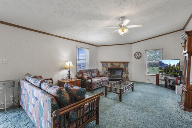 11791 Coontz Rd, Orient, OH 43146 - living area with carpet floors, crown molding, a ceiling fan, a textured ceiling, and a stone fireplace