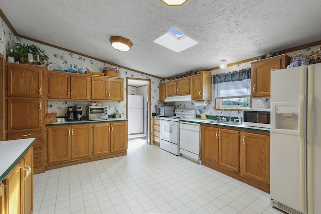 11791 Coontz Rd, Orient, OH 43146 - kitchen featuring white appliances, crown molding, brown cabinets, wallpapered walls, and lofted ceiling