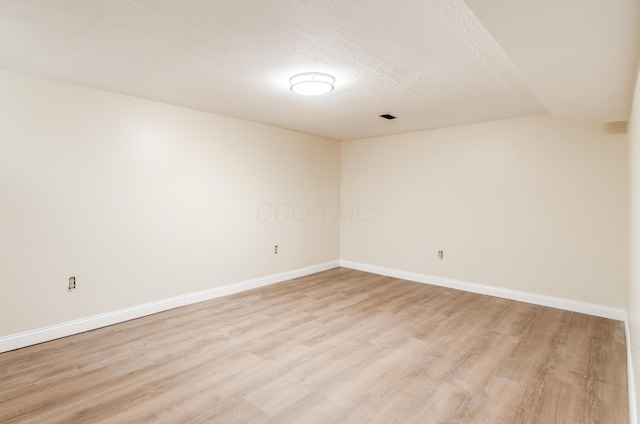 4963 Buck Thorn Ln, Columbus, OH 43220 - empty room featuring light wood-style floors and a textured ceiling