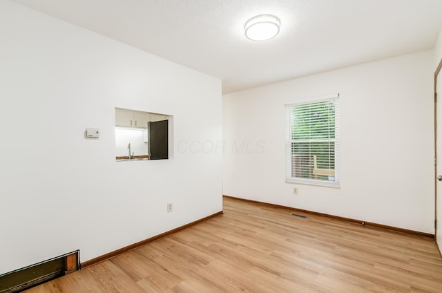 4963 Buck Thorn Ln, Columbus, OH 43220 - spare room featuring light wood-style floors and a sink