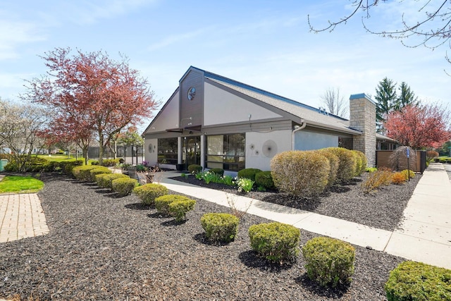 4635 Shalers Dr Unit 44D, Columbus, OH 43228 - view of front facade with stucco siding and a chimney