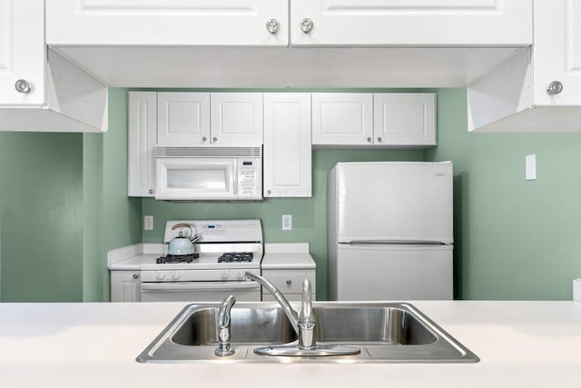 4635 Shalers Dr Unit 44D, Columbus, OH 43228 - kitchen featuring white appliances, light countertops, and white cabinetry