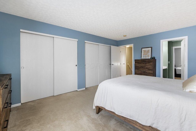 4635 Shalers Dr Unit 44D, Columbus, OH 43228 - bedroom featuring multiple closets, carpet flooring, and a textured ceiling