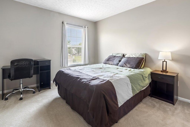 4635 Shalers Dr Unit 44D, Columbus, OH 43228 - bedroom featuring light carpet, a textured ceiling, and an office area