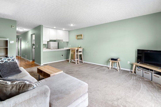 4635 Shalers Dr Unit 44D, Columbus, OH 43228 - living area with a textured ceiling, recessed lighting, and carpet floors