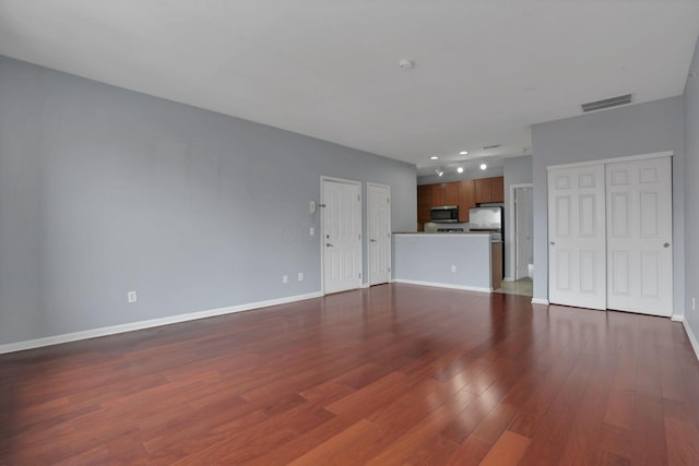 336 S 3rd St Unit 3, Columbus, OH 43215 - unfurnished living room featuring wood finished floors and baseboards