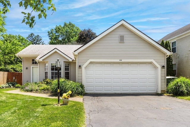8000 Leaview Dr, Columbus, OH 43235 - view of front of home featuring a garage, asphalt driveway, and a shingled roof